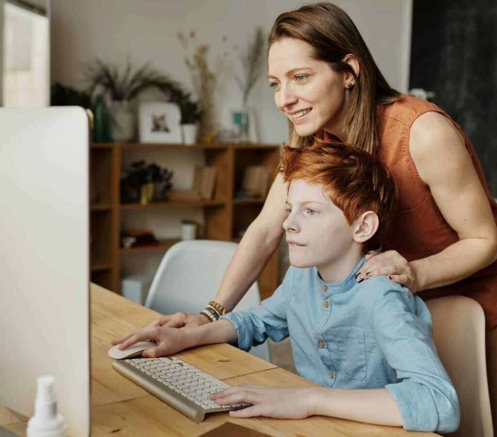 mom and son on computer