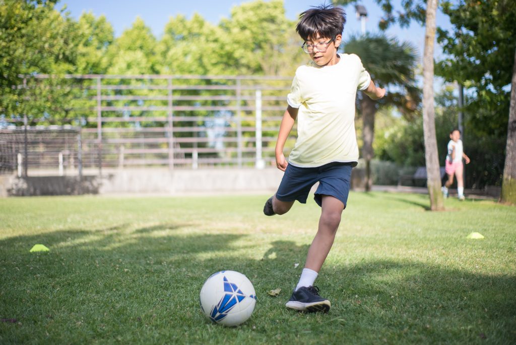 Boy plays soccer